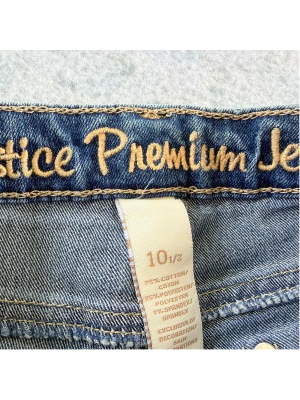Y2K Justice blue denim shorts with white lace trim on the hem and pockets, size